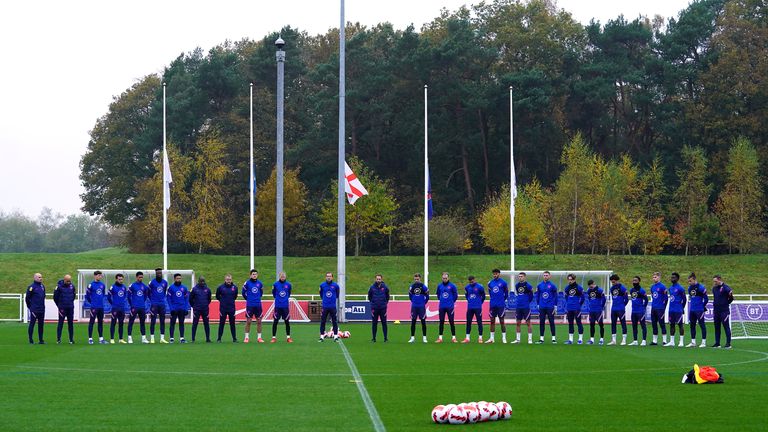 England players and staff observe a silence for Remembrance Day ahead of a training session at St George&#39;s Park, Burton-upon-Trent. Picture date: Thursday November 11, 2021.