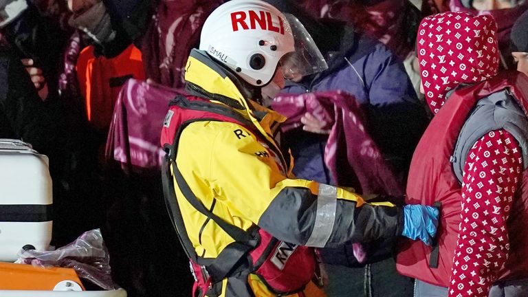 A group of people thought to be migrants are brought into Dover by the RNLI