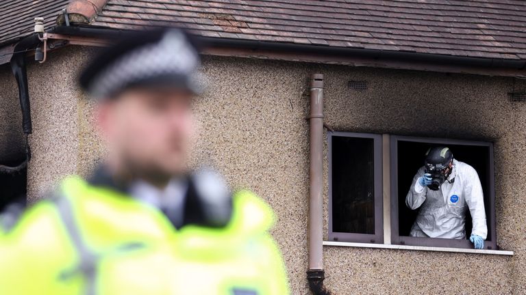 fire An investigator inspects the scene of a house fire in Bexleyheath, London, Britain November 19, 2021. REUTERS/Tom Nicholson
