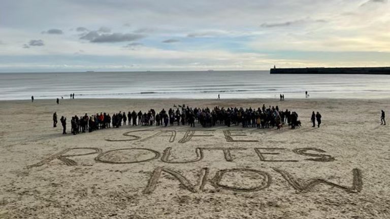 People gathered on the beach in Folkestone on Sunday as a bell was rung 27 times in memory of the 27 people who died crossing the Channel