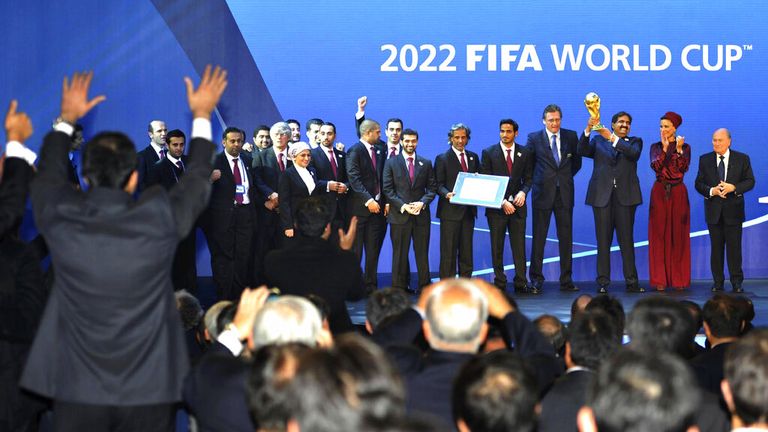 Emir Shekikh Hamad bin Khalifa al Thani of Qatar, holding a replica of the World Cup, Russian delegation are jubilant after the annoucements made by FIFA President Sepp Blatter, right, that Russia and Qatar will be host countries for the FIFA World Cup 2018 and 2022 respectively, in Zurich, Dec. 2, 2010. ( The Yomiuri Shimbun via AP Images )