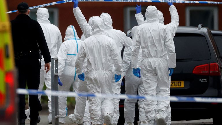 Forensic police officers walk towards the scene of a car blast outside Liverpool Women's Hospital, in Liverpool, Britain, November 15, 2021. REUTERS/Phil Noble

