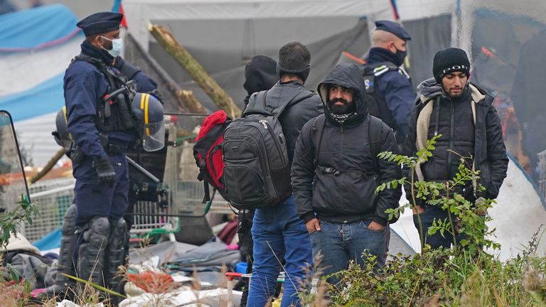 French police evacuate a makeshift migrant camp on the site of a former industrial complex in Grande-Synthe, east of Dunkirk, where at least 1,500 people had gathered in hopes of making it across the English Channel to Britain. Picture date: Tuesday November 16, 2021.
