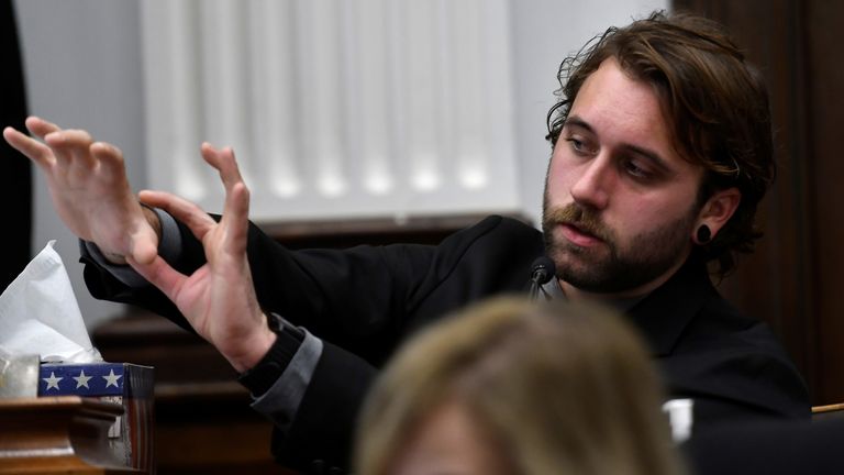 Gaige Grosskreutz talks about the lasting damage done to his arm from the gunshot wound received from Kyle Rittenhouse as he testifies at the Kenosha County Courthouse in Kenosha, Wis., U.S. on Monday, Nov. 8, 2021. Sean Krajacic/Pool via REUTERS
