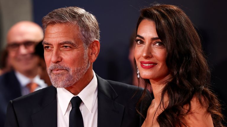 FILE PHOTO: Director George Clooney and his wife lawyer Amal Clooney arrive for a screening of the film "The Tender Bar". REUTERS/Henry Nicholls/File Photo