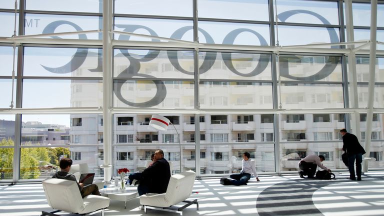 Attendees sits in front of a Google logo during Google I/O Conference at Moscone Center in San Francisco, California June 28, 2012. REUTERS/Stephen Lam (UNITED STATES - Tags: BUSINESS SCIENCE TECHNOLOGY)