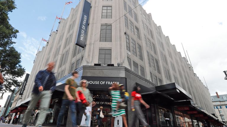 Pedestrians walk past the House of Fraser department store on Oxford Street in London. Pic: AP