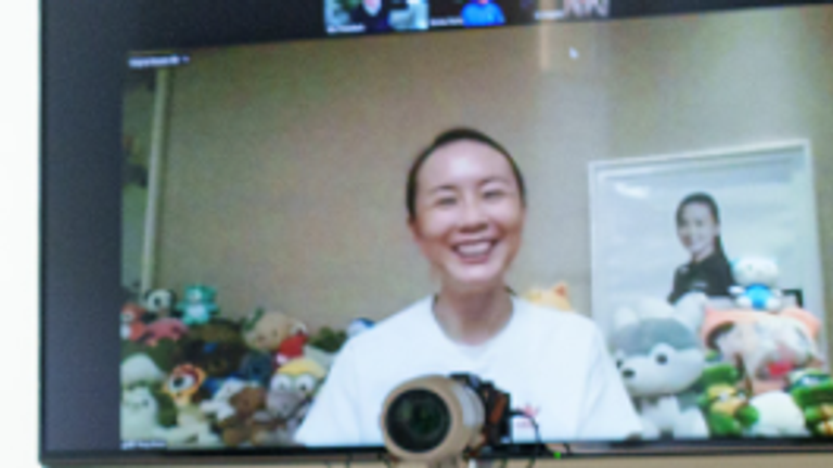 Peng Shuai seen on a screen in an IOC office