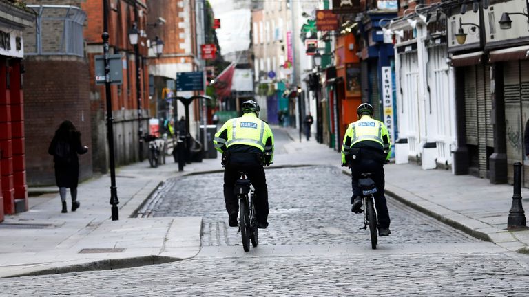 Irish police patrol a deserted Temple Bar in Dublin in March 2021. Pic: AP