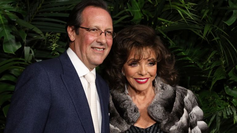 Percy Gibson, left, and Joan Collins arrive at the Chanel Pre-Oscar Dinner at The Beverly Hills Hotel in 2020. Pic: Willy Sanjuan/Invision/AP 
