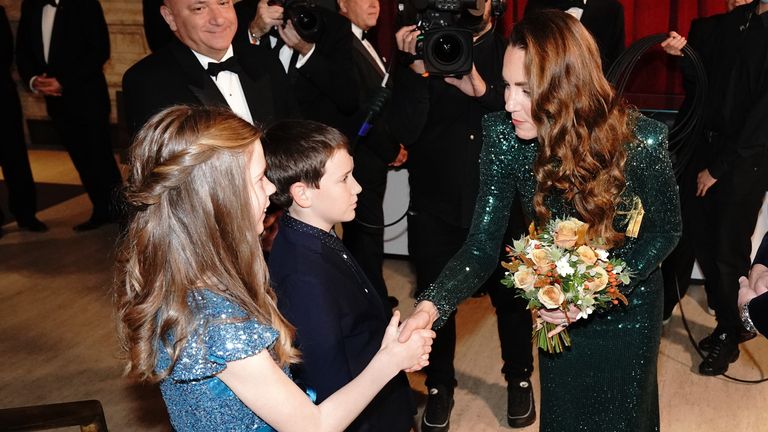 The Duchess of Cambridge is given a posy during the Royal Variety Performance at the Royal Albert Hall, London. Picture date: Thursday November 18, 2021.

