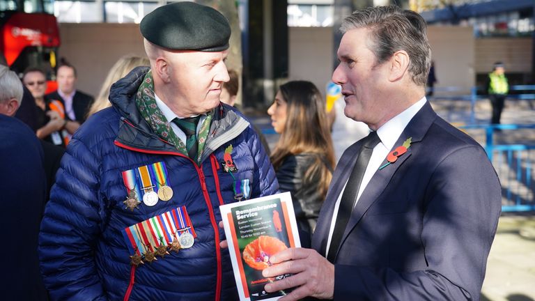 Labour leader Sir Keir Starmer (right) talks to a veteran after a short Remembrance Service at the war memorial at Euston Station to remember the war dead on Armistice Day. Picture date: Thursday November 11, 2021.
