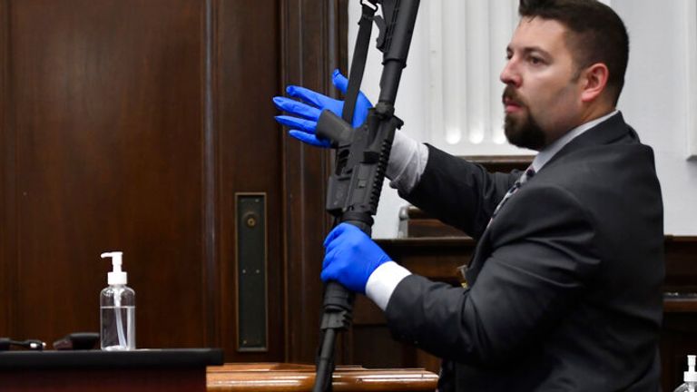 Kenosha Police detective Ben Antaramian showed the weapon that Rittenhouse used
