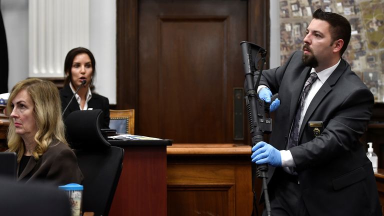 Heather Williams, left, a firearms examiner, identifies the rifle Kyle Rittenhouse used