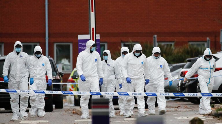 Forensic police officers leave the scene of a car blast outside Liverpool Women&#39;s Hospital, in Liverpool, Britain, November 15, 2021. REUTERS/Phil Noble

