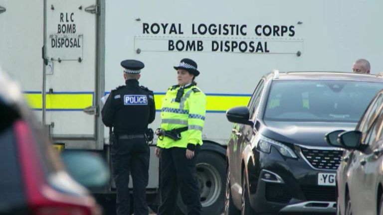Bomb disposal experts are pictured at the scene