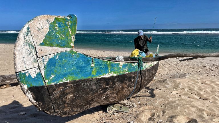 A fishing boat lies stranded on the sands at Faux Cap, Madagascar