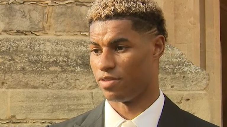 Marcus Rashford receives an MBE from Prince William