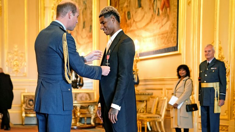 Footballer Marcus Rashford is made an MBE (Member of the Order of the British Empire) by the Duke of Cambridge during an investiture ceremony at Windsor Castle. Picture date: Tuesday November 9, 2021.
