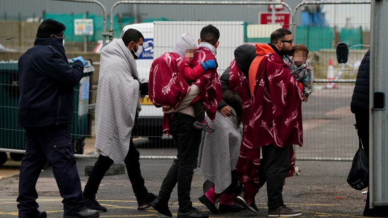 EDITORS NOTE Children&#39;s faces have been pixelated as the PA Picture Desk has been unable to gain the necessary permission to photograph a child under 16 on issues involving their welfare. A group of people thought to be migrants arrive in Dover, Kent, after being rescued by the Dover lifeboat, following a small boat incident in the Channel. Picture date: Thursday November 11, 2021.