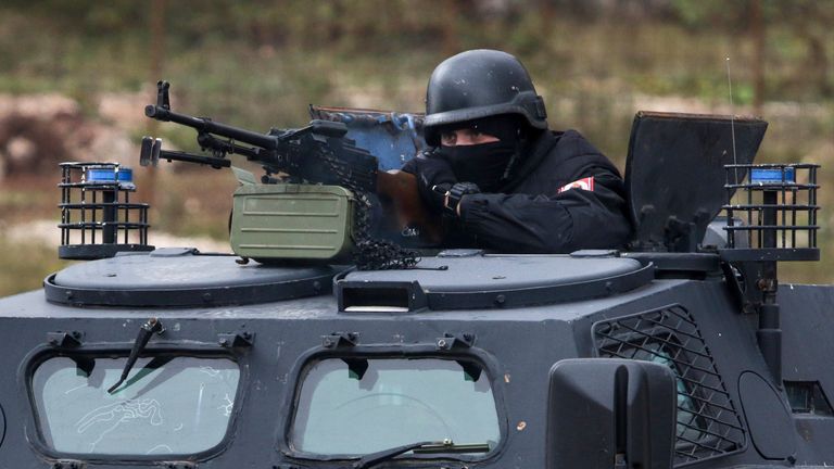 A member of the Republika Srpska police force manning a machine gun during a recent exercise