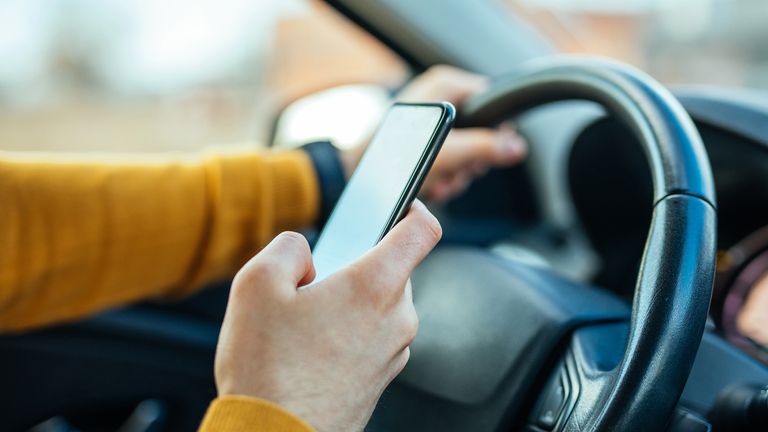 The government is set to strengthen existing laws around using handheld phones while driving 