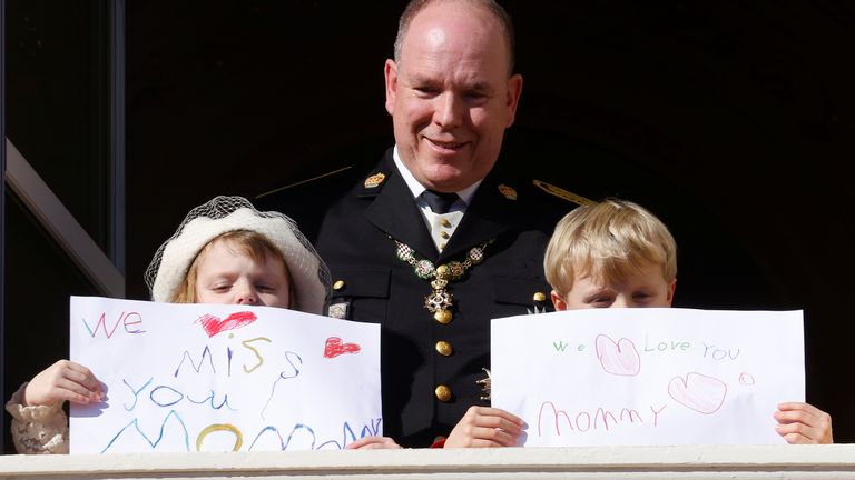 Princess Gabriella, left, and Prince Jacques hold their messages to their mother