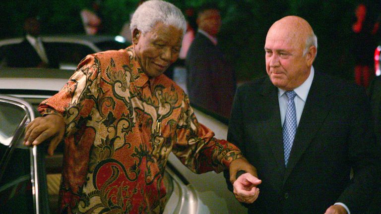 Nobel Peace Laureate Nelson Mandela is helped out of his car as he arrives for the 70th birthday celebrations of fellow Nobel Peace Laureate FW de Klerk (R) in Cape Town, March 17, 2006. De Klerk turns 70 on March 18. REUTERS/Mike Hutchings
