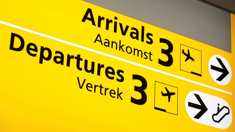 FILE PHOTO: The "Arrivals" and "Departures" boards are pictured at Schiphol airport after Dutch health authorities said that 61 people who arrived in Amsterdam on flights from South Africa tested positive for the coronavirus disease (COVID-19), in Amsterdam, Netherlands, November 27, 2021. REUTERS/Eva Plevier/File Photo
