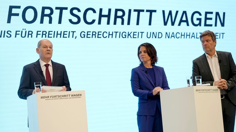 Olaf Scholz, SPD candidate for Chancellor and Executive Federal Minister of Finance, Annalena Baerbock, Federal Chairwoman of Alliance 90/The Greens, and Robert Habeck, Federal Chair of Alliance 90/The Greens, present the joint coalition agreement. Pic: AP