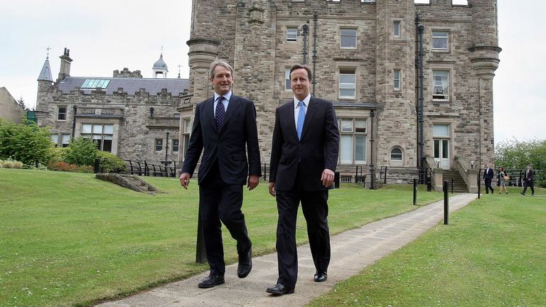 Secretary of State for Northern Ireland Owen Paterson (L) walks with Britain's Prime Minister David Cameron outside Stormont Castle in Belfast, Northern Ireland, May 20, 2010. REUTERS/Paul Faith/Pool (NORTHERN IRELAND - Tags: POLITICS)
