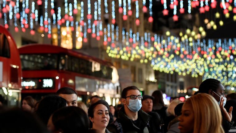 Shoppers view a Christmas light display along Oxford Street, London, Britain, November 20, 2021. REUTERS/Toby Melville
