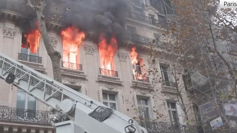 Building next to Paris opera catches fire