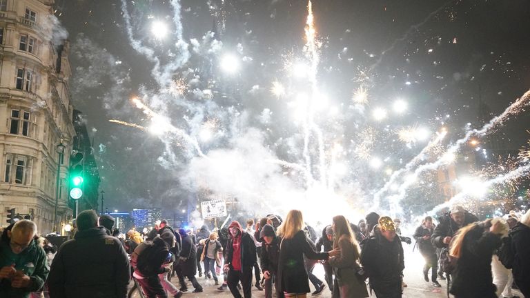 Fireworks are let off as people take part in the Million Mask March 2021 in Parliament Square, London. Picture date: Friday November 5, 2021.
