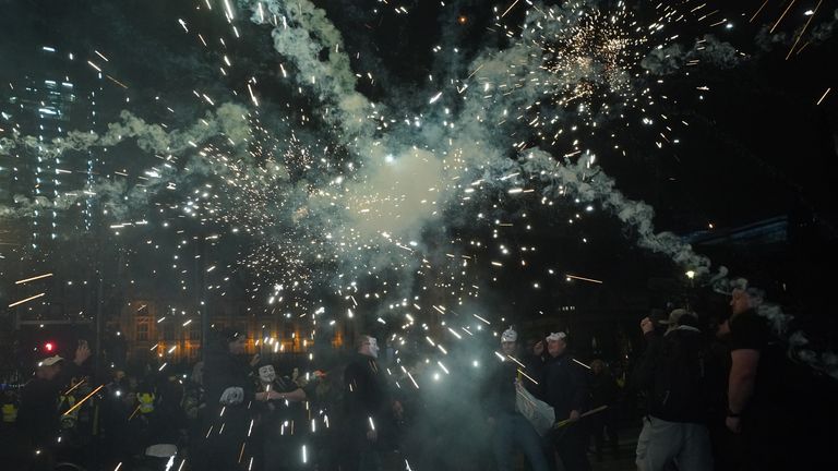 Fireworks are let off as people take part in the Million Mask March 2021 in Parliament Square, London. Picture date: Friday November 5, 2021.