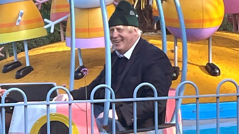 Britain&#39;s Prime Minister Boris Johnson, his wife Carrie Johnson and son enjoy a ride at Peppa Pig World near Ower, England, Britain November 21, 2021. Picture taken November 21, 2021. George Edgar/Handout via REUTERS  THIS IMAGE HAS BEEN SUPPLIED BY A THIRD PARTY. MANDATORY CREDIT