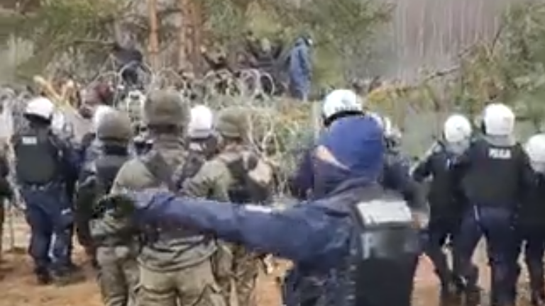 Video posted by Polish officials showed migrants trying to break through the barbed wire