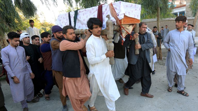 Men carry the coffin of one of three female polio vaccination health workers who were shot and killed by unknown gunmen at two separate locations, during a burial ceremony in Jalalabad, Afghanistan March 30, 2021.