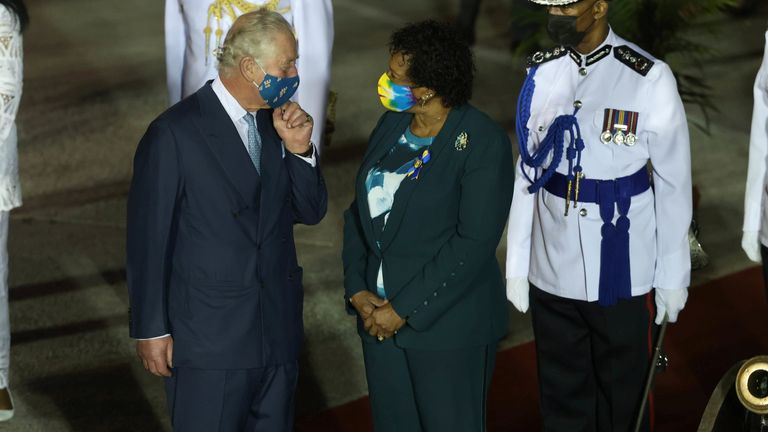 Prince Charles speaks with Barbadian President-elect Sandra Mason on his arrival