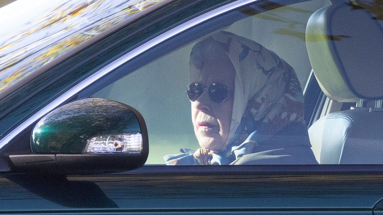 Queen Elizabeth II driving her Jaguar car in the grounds of Windsor Castle Pic: Shutterstock