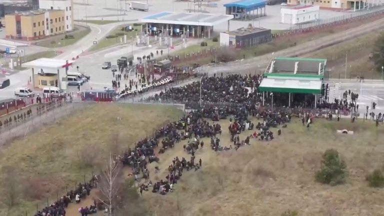 Migrants gather on the Belarusian-Polish border in an attempt to cross it at the Bruzgi-Kuznica Bialostocka border crossing, Belarus November 15, 2021, in this still image taken from video. Belteleradiocompany/Handout via REUTERS ATTENTION EDITORS - THIS IMAGE HAS BEEN SUPPLIED BY A THIRD PARTY. NO RESALES. NO ARCHIVES. MANDATORY CREDIT.
