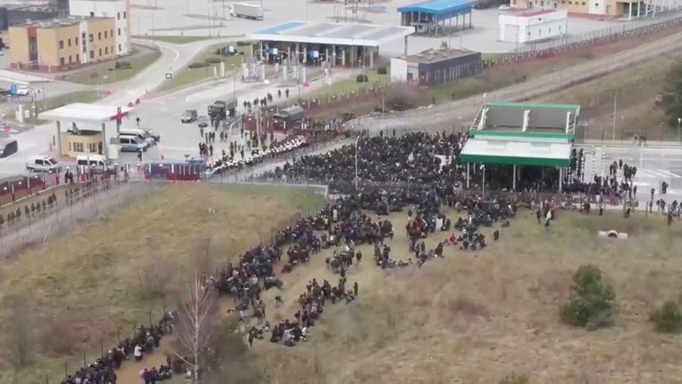 Migrants gather on the Belarusian-Polish border in an attempt to cross it at the Bruzgi-Kuznica Bialostocka border crossing, Belarus November 15, 2021, in this still image taken from video. Belteleradiocompany/Handout via REUTERS ATTENTION EDITORS - THIS IMAGE HAS BEEN SUPPLIED BY A THIRD PARTY. NO RESALES. NO ARCHIVES. MANDATORY CREDIT.
