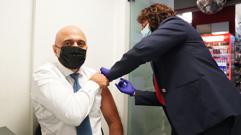 Health Secretary Sajid Javid receives his Covid-19 booster jab from Nikki Kanani, Medical director primary care NHS England, at a pharmacy in central London. Picture date: Wednesday November 17, 2021.

