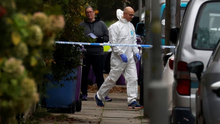 A forensic police officer walks outside an address in the Sefton Park area, following a car blast outside Liverpool Women's Hospital, in Liverpool, Britain, November 15, 2021. REUTERS/Phil Noble
