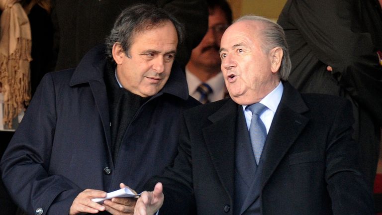 FIFA president Sepp Blatter, right, talks to UEFA president Michel Platini during the World Cup group C soccer match between Slovenia and the United States at Ellis Park Stadium in Johannesburg, South Africa, Friday, June 18, 2010.  (AP Photo/Martin Meissner)