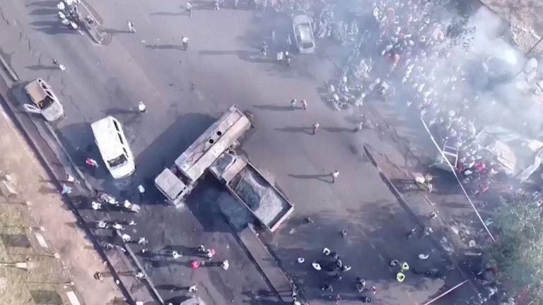 The explosion took place this morning after a bus struck the tanker in a suburb of the capital, with 99 confirmed dead.