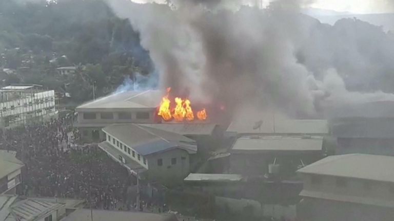 Video shows protests and fires in the streets of Honiara.