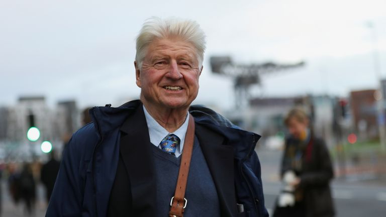 Stanley Johnson, father of Britain&#39;s Prime Minister Boris Johnson, reacts as he walks during the UN Climate Change Conference (COP26) in Glasgow, Scotland, Britain, November 9, 2021. REUTERS/Russell Cheyne
