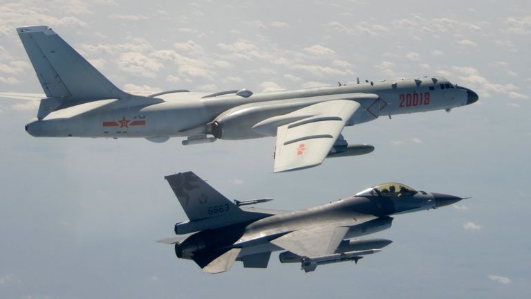 A Taiwanese air force F16 in the foreground flies on the flank of a Chinese People&#39;s Liberation Army Air Force H6 bomber as it passes near Taiwan. File pic: AP