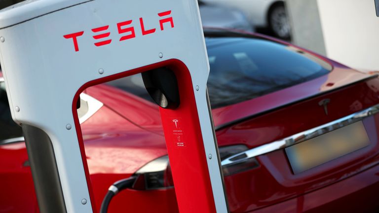 A Tesla car is charged at a Tesla dealership in West Drayton, just outside London, Britain, February 7, 2018. REUTERS/Hannah McKay